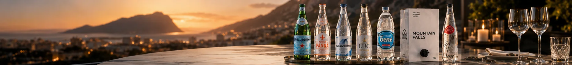 The full AquaCart range on a marble table at a coastal sunset terrace